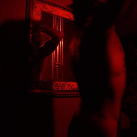 Self Portrait in Red © Aret Zelli 2024