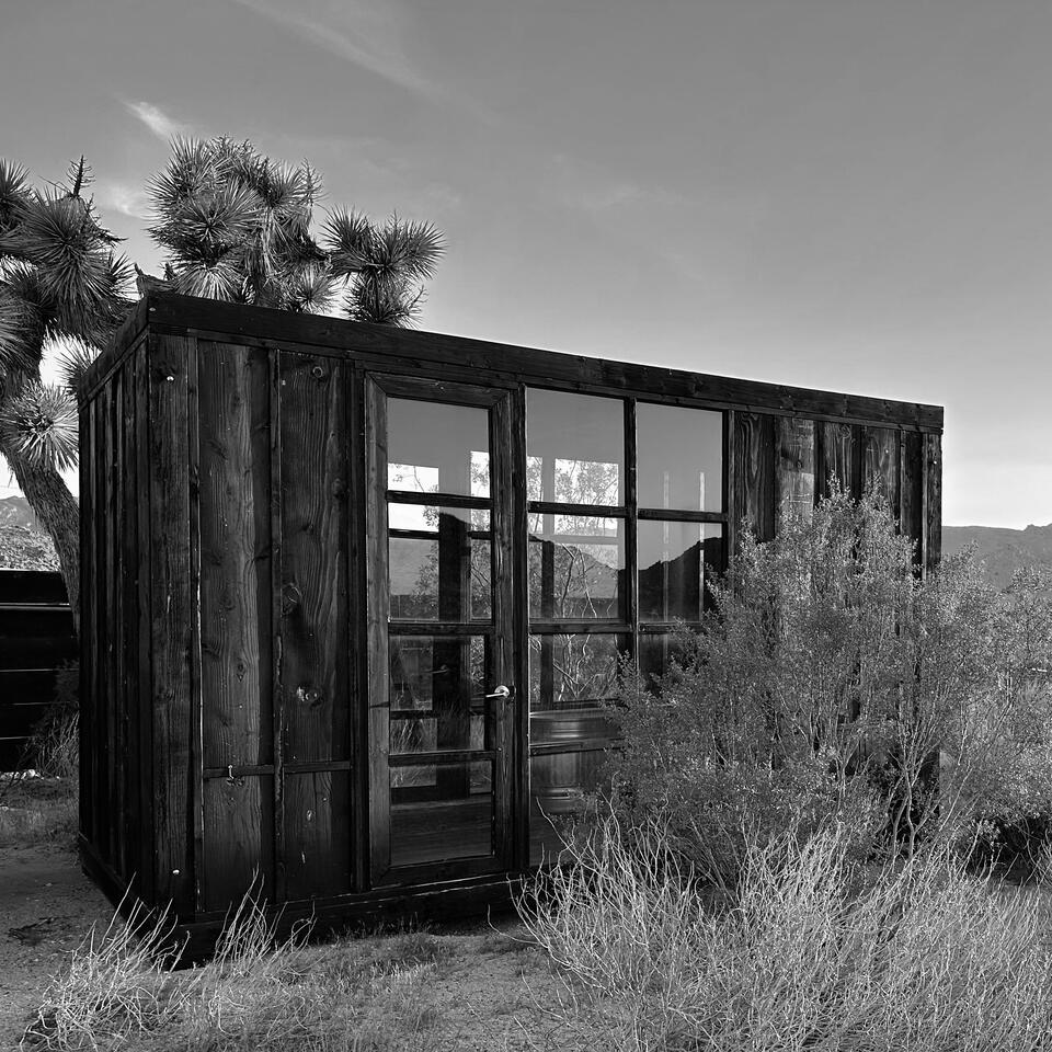 Blackened wood and glass house. 2019, Joshua Tree, California